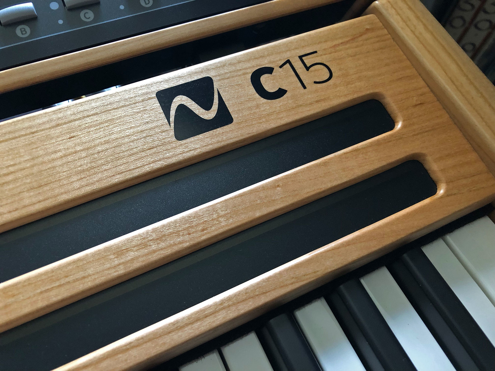 Closeup of C15 logo on synth.