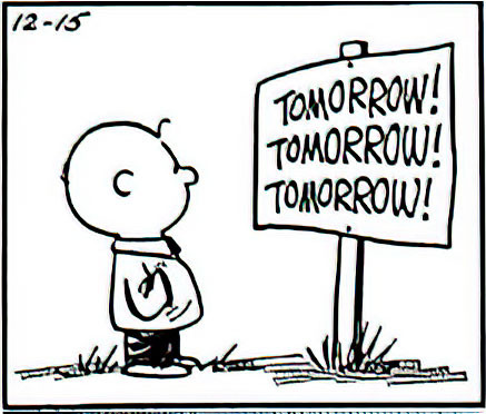 He stops and faces another sign that says “Tomorrow! Tomorrow! Tomorrow!”