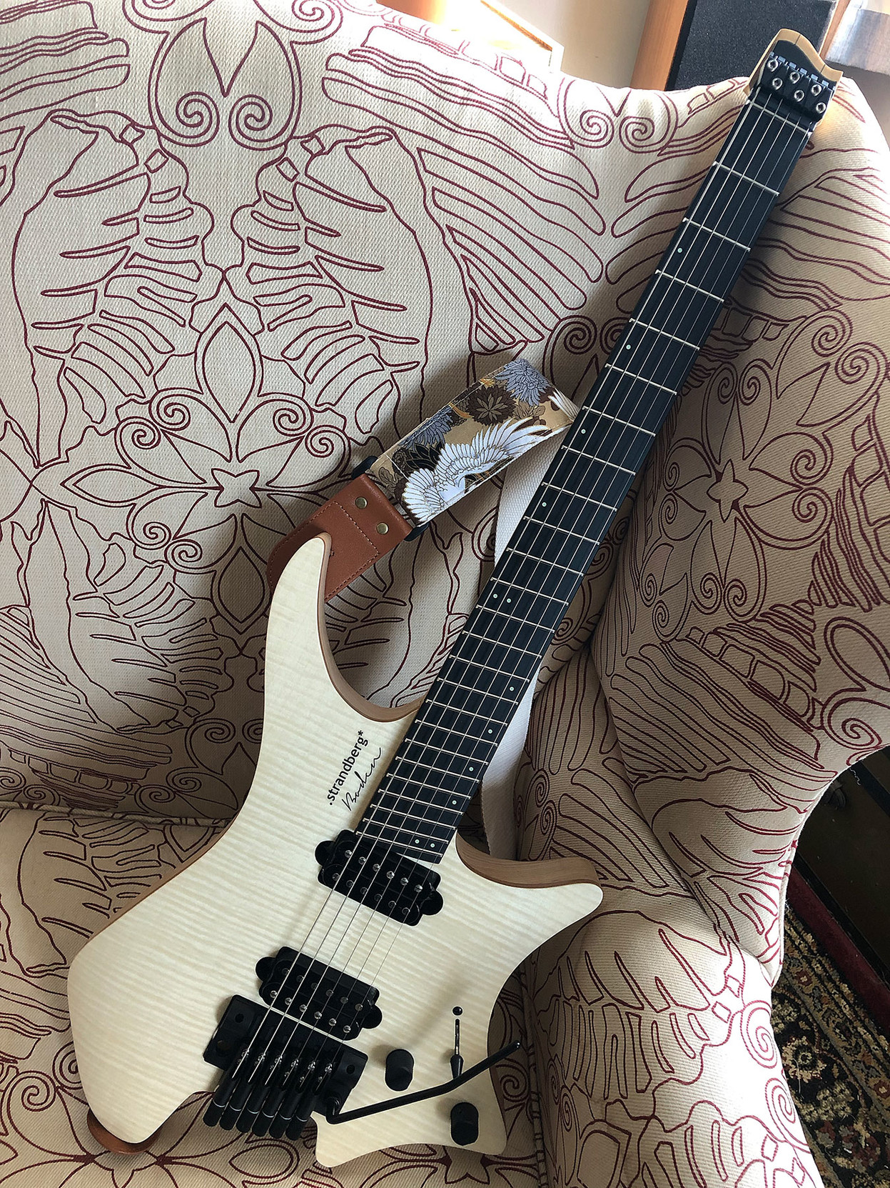 Another view of the full guitar. 

You can see that it’s headless (no headstock) and the tuners are at the bottom, below the bridge.