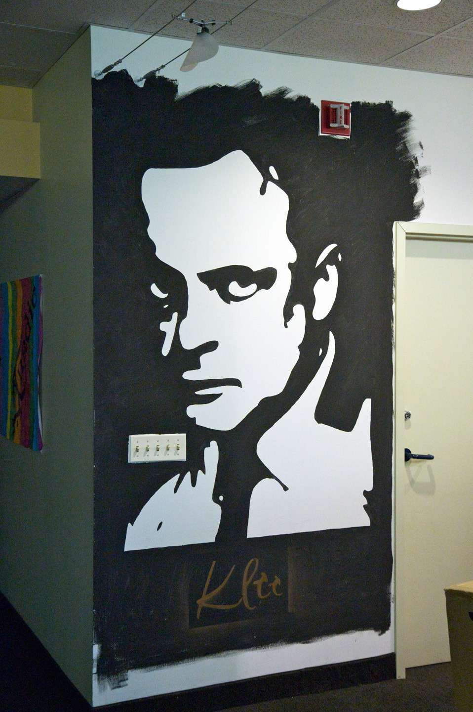 An image of Paul Klee, in white on a black background. 

It was rendered using black paint, leaving the unpainted white areas as the positive image of Klee.