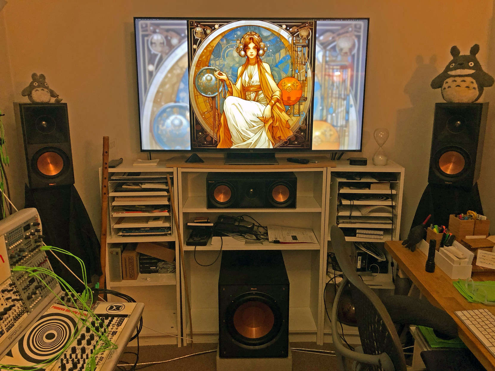 A view of the front end of my studio, with the copper-toned drivers of my new Klipsch Reference Premier monitors in sight.

And a pair of Totoros, too!