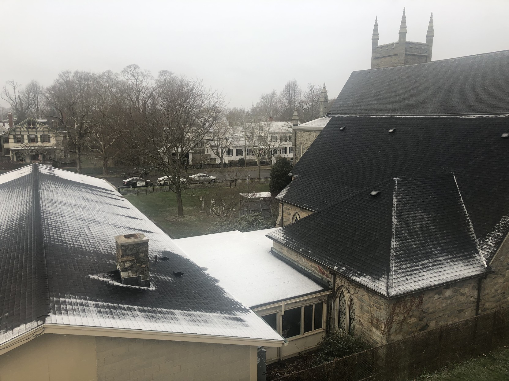 The view from my bedroom window … just a light dusting of snow on the church next door.