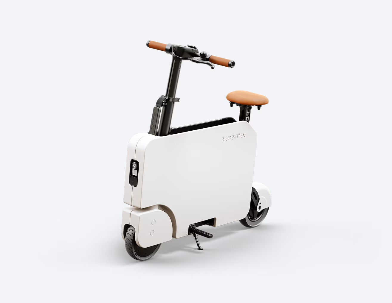 The Honda Motocompacto! It looks like a white briefcase with a seat and handlebars. A seriously goofy/cool little scooter. I wants one.
