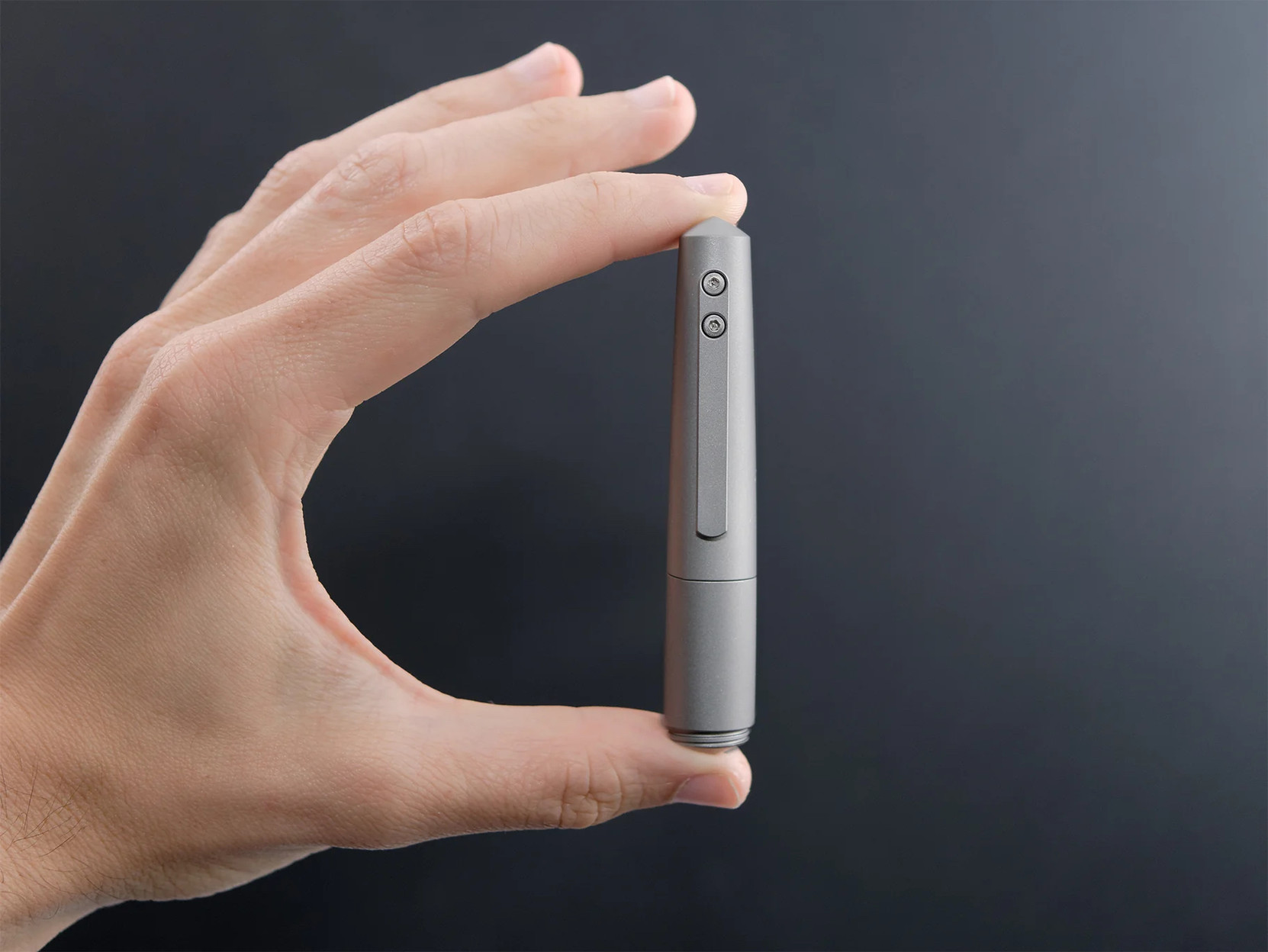 The Namisu Nova Pocket “Beadblasted” model, with hand for scale.