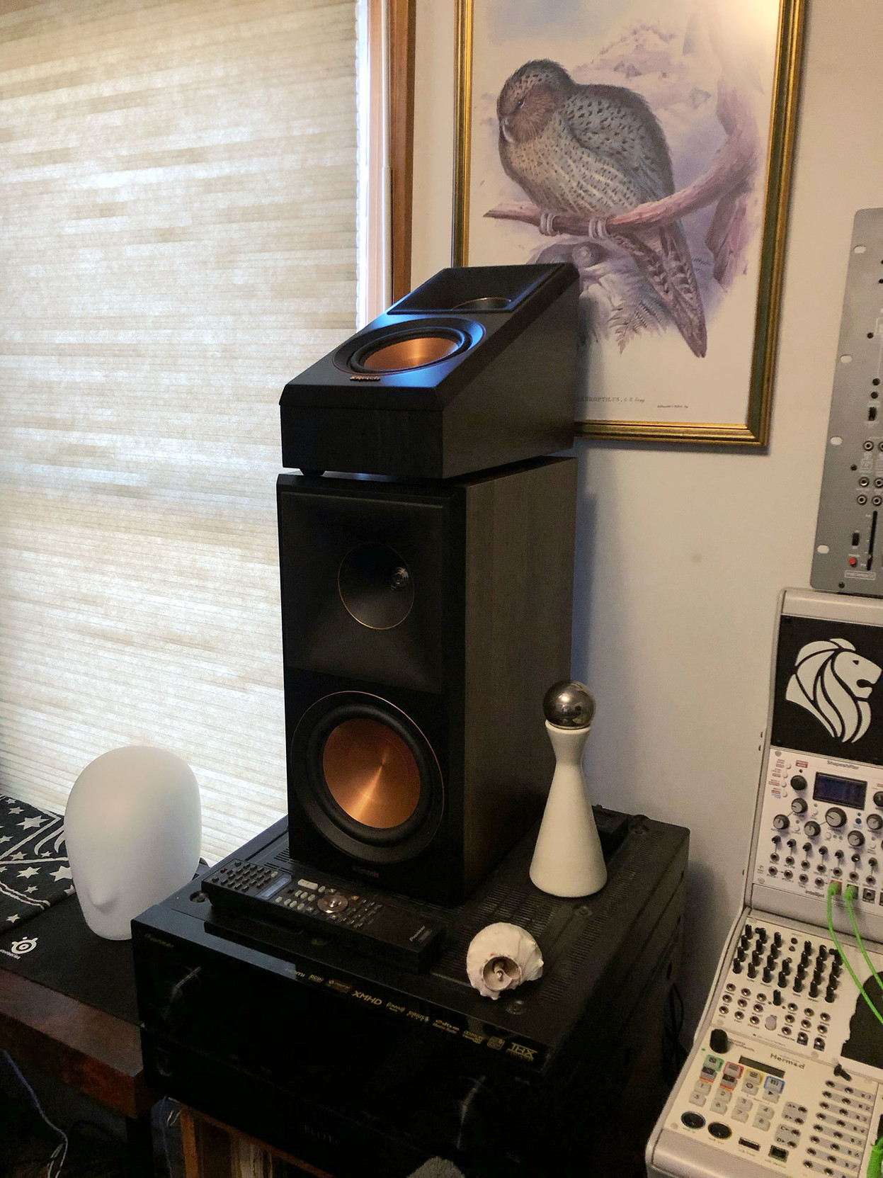 I put one of the surround speakers on top of the left center channel, for more of a side view.