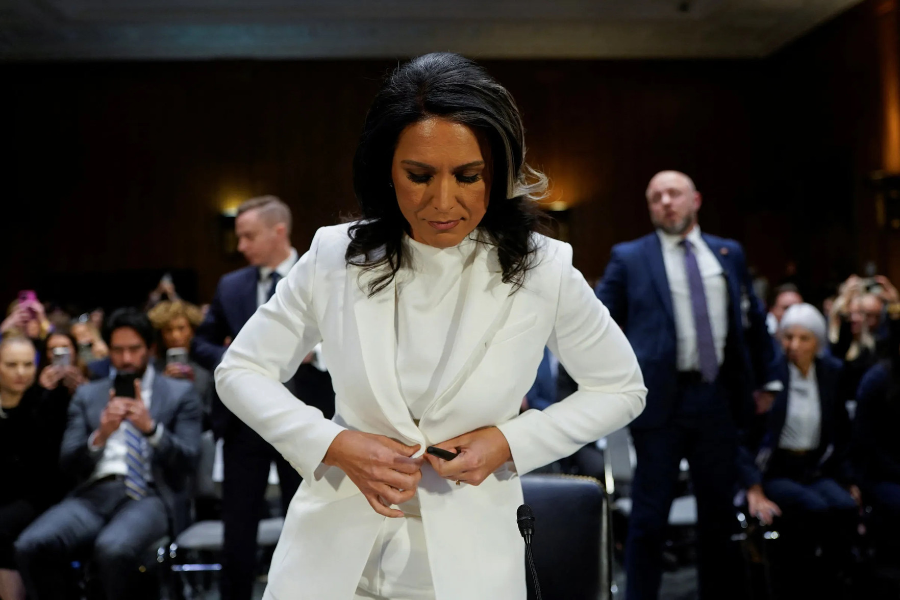 Tulsi Gabbard, straightening her Cheeto Woman costume.