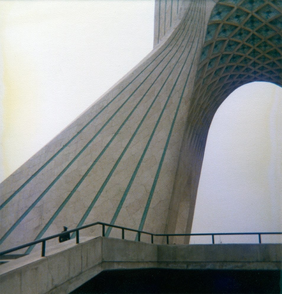 A guard can be seen at the base of Azadi Tower, an utterly breathtaking work of architecture. 

While the guard might look a little forbidding, visitors were welcome, and this was taken after we had visited and gone to the top. After we left, I got out of the car and ran back to take photos … which wasn’t allowed inside the tower.

I’m trying to find an uncropped shot I know I have somewhere.