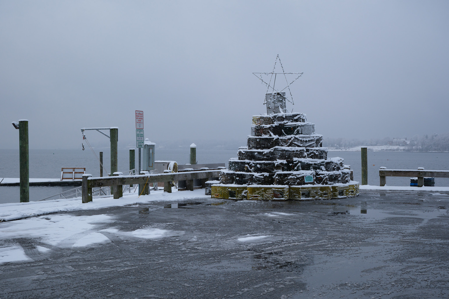 A pile of lobster traps, turned into a whimsical tree with a star on the top.