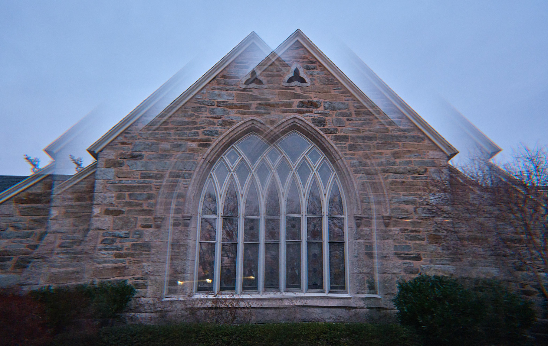 I shot these in a way that maintained symmetry, and they came out looking pretty creepy.

These are from the Congregational church next door.