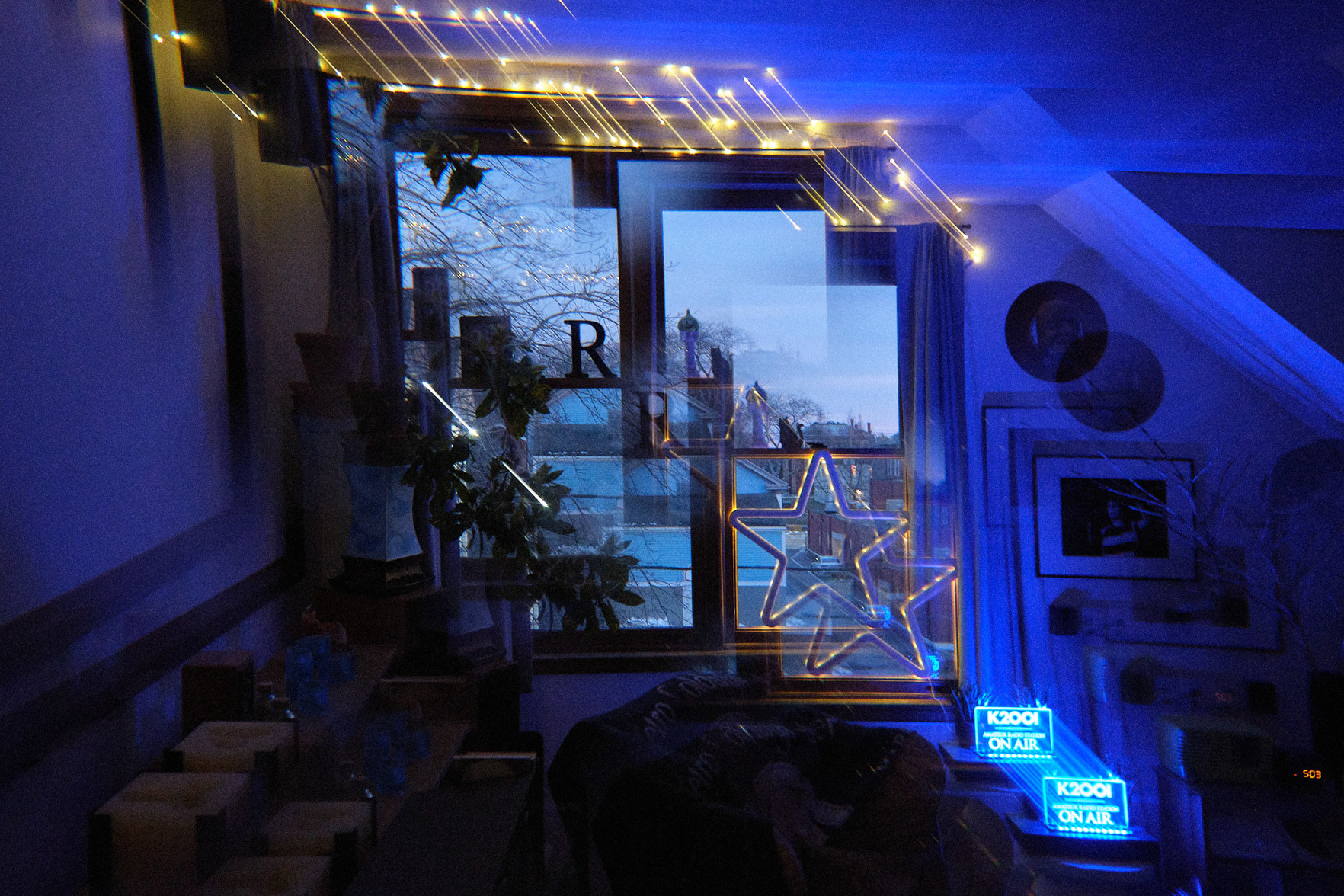 Taken in my living room at dusk.

Again, kind of evocative of the multi-dimensional conduit from the movie “Interstellar.” 